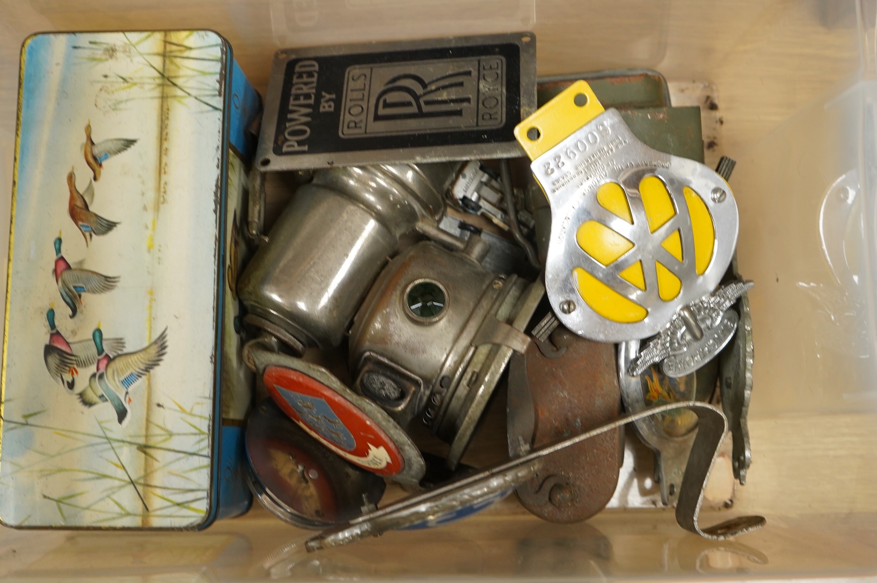 Automobilia items, including six mid-20th century car badges; AA, RAC, the Royal Sussex regiment, East Sussex, etc., together with a Smiths dashboard clock, a Rolls-Royce plaque, two early motoring lamps, a W&R Jacob & C